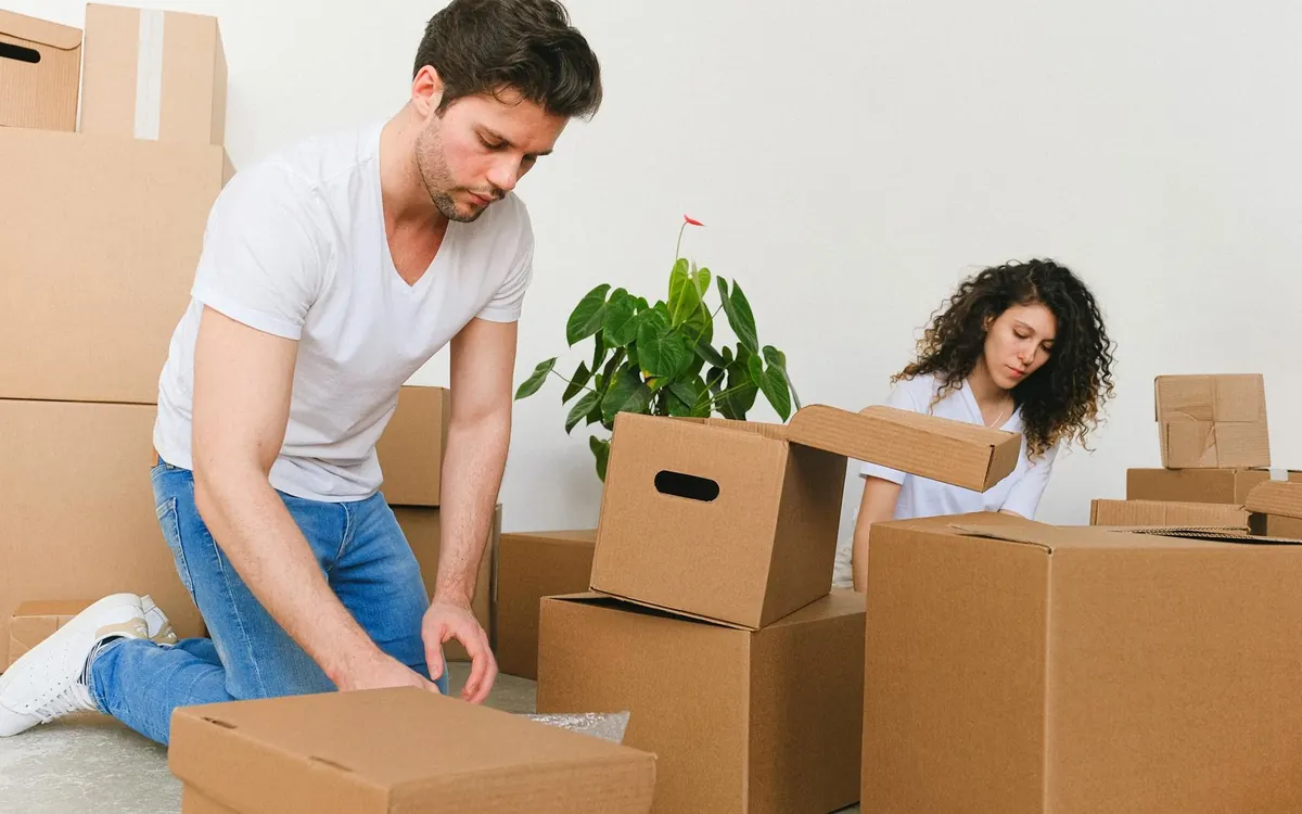Furniture and moving boxes arriving at a home