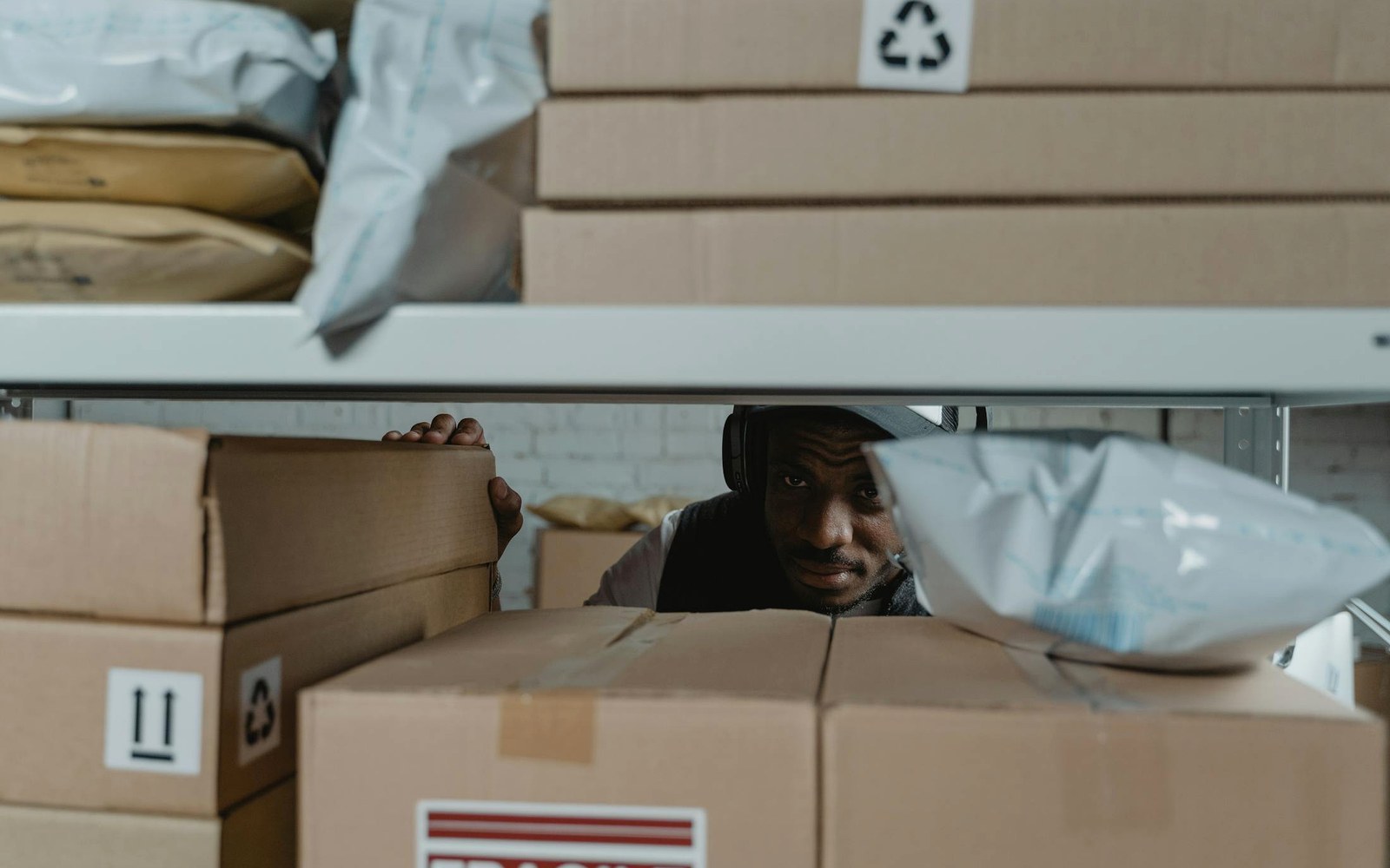 Warehouse worker inspecting shipment packages before export